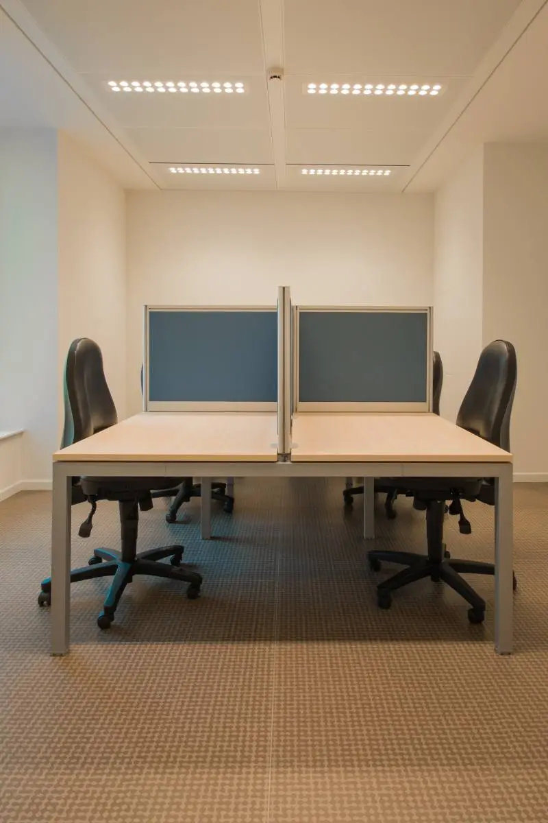 Office desk pods with screens designed for staff during a commercial refurbishment