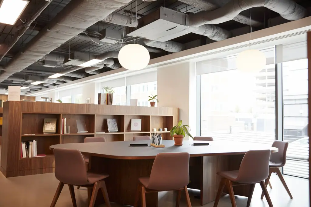 Modern meeting area with chairs around a table, office layout by The Commercial Interior Company Ltd